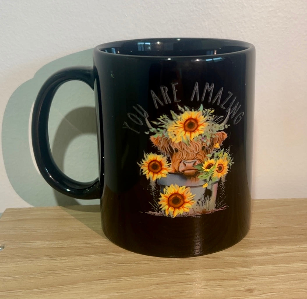 High land cow with sun flowers coffee mug
