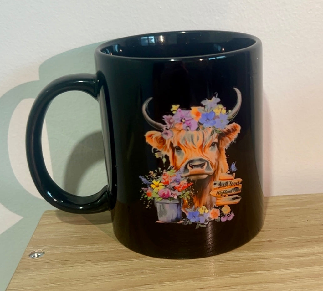 High land cow with floral coffee mug