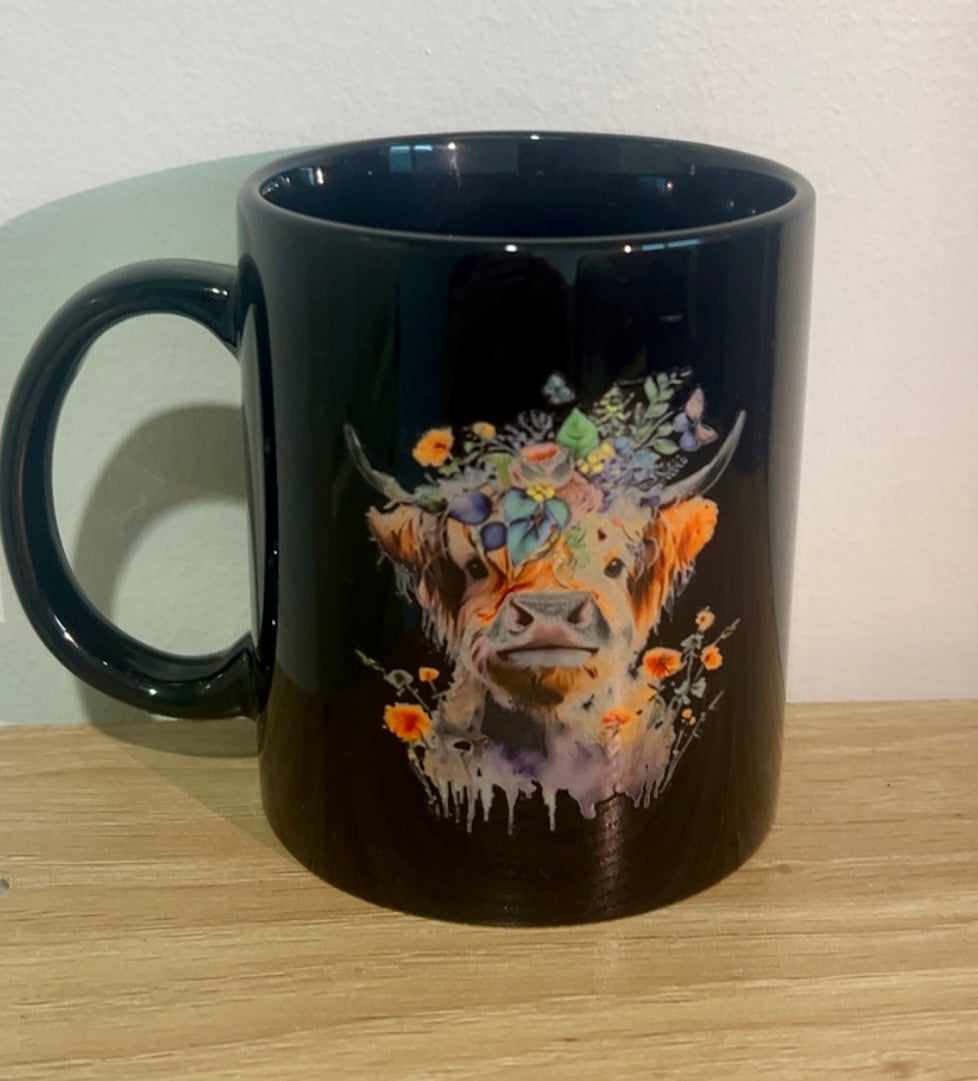 High land cow with floral coffee mug